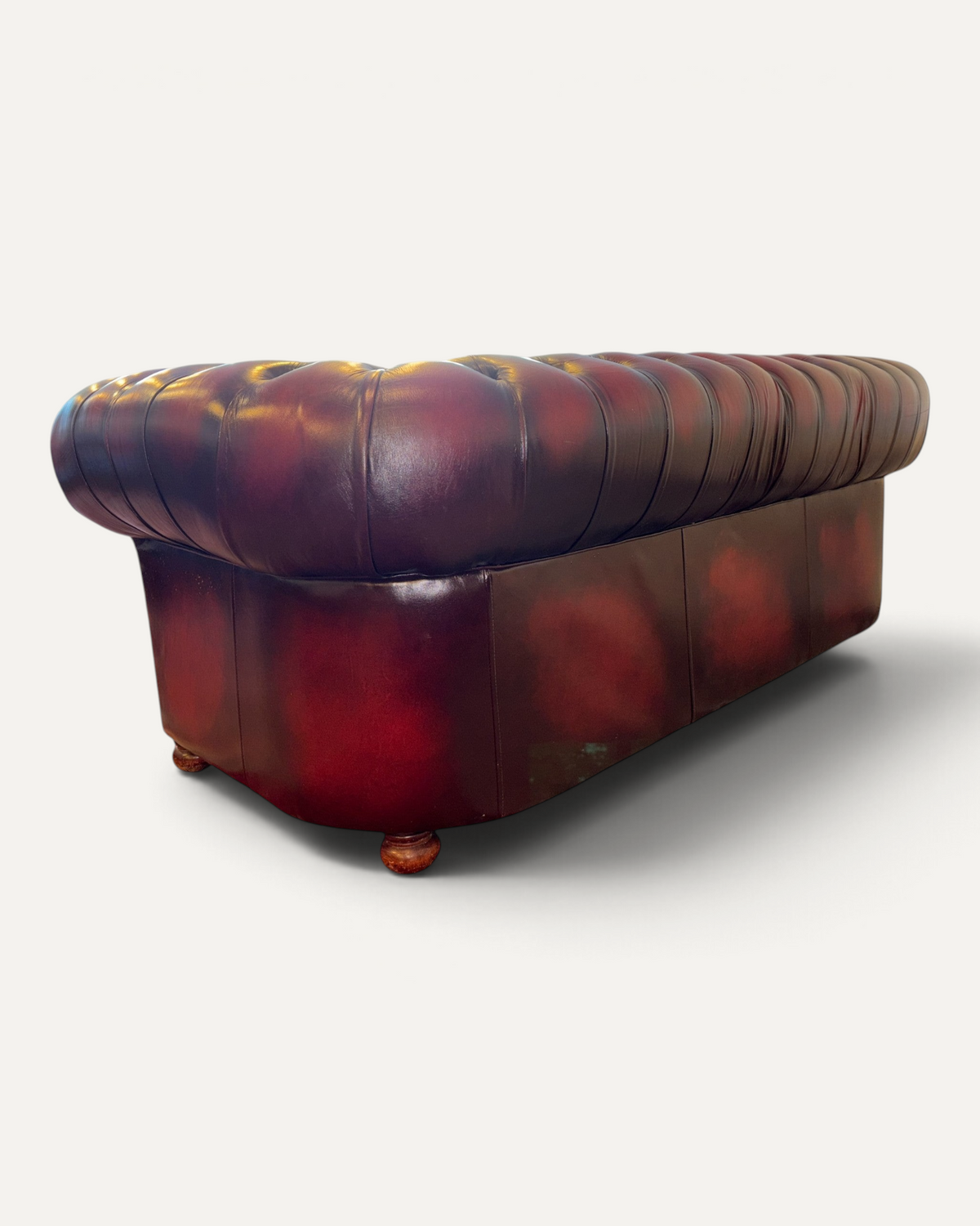 Chesterhome vintage 3-seater Chesterfield sofa in oxblood leather with deep button tufting and rolled back design.